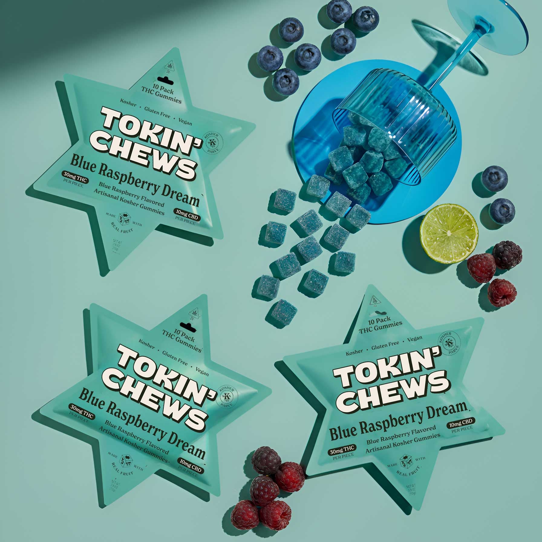 Tokin’ Chews blue raspberry cannabis gummies product packaging with berries on green background