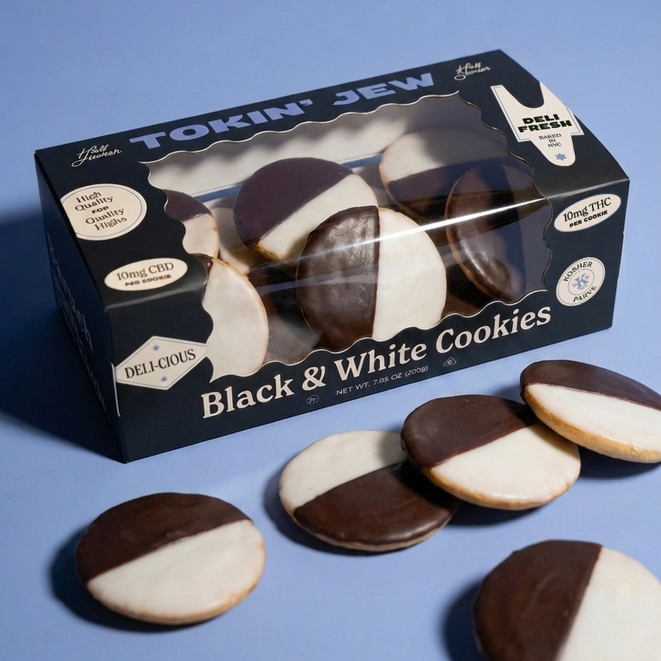 A box of Tokin' Jew Black & White Cookies on a solid blue background, with several cookies displayed in front of the package.