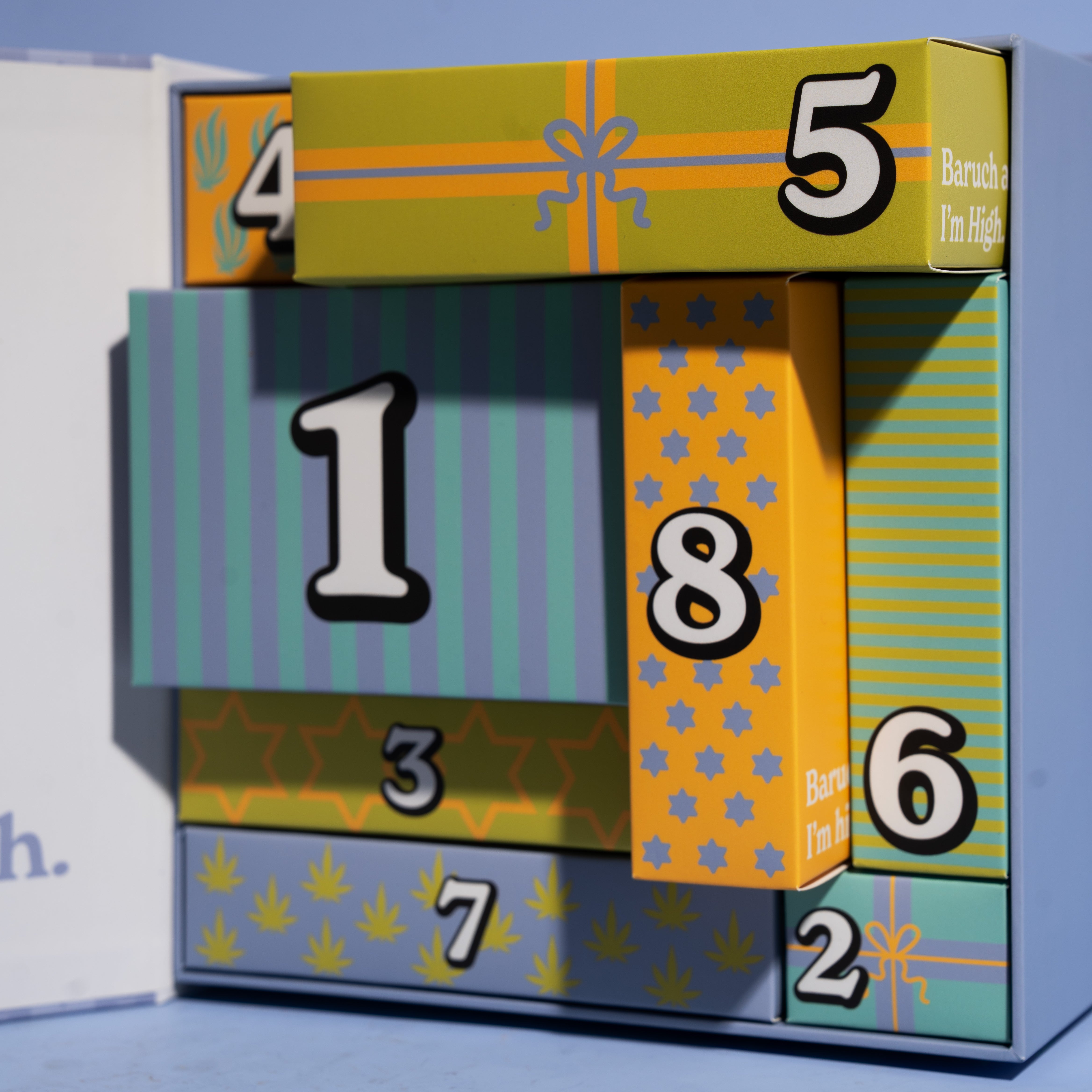 Stack of advent calendar boxes on a blue background