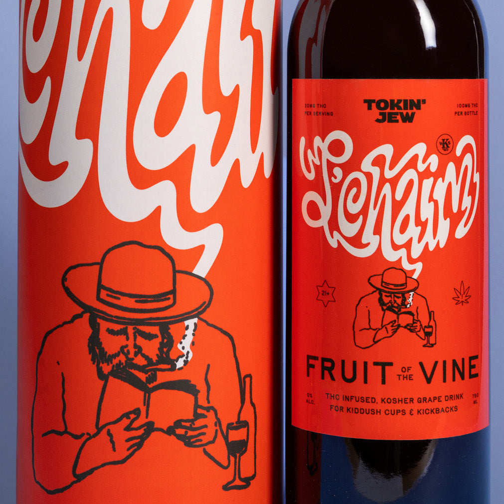 Tokin Jew 'Fruit of the Vine' kosher grape drink with a bold red and white label design, set against a solid blue-gray background.