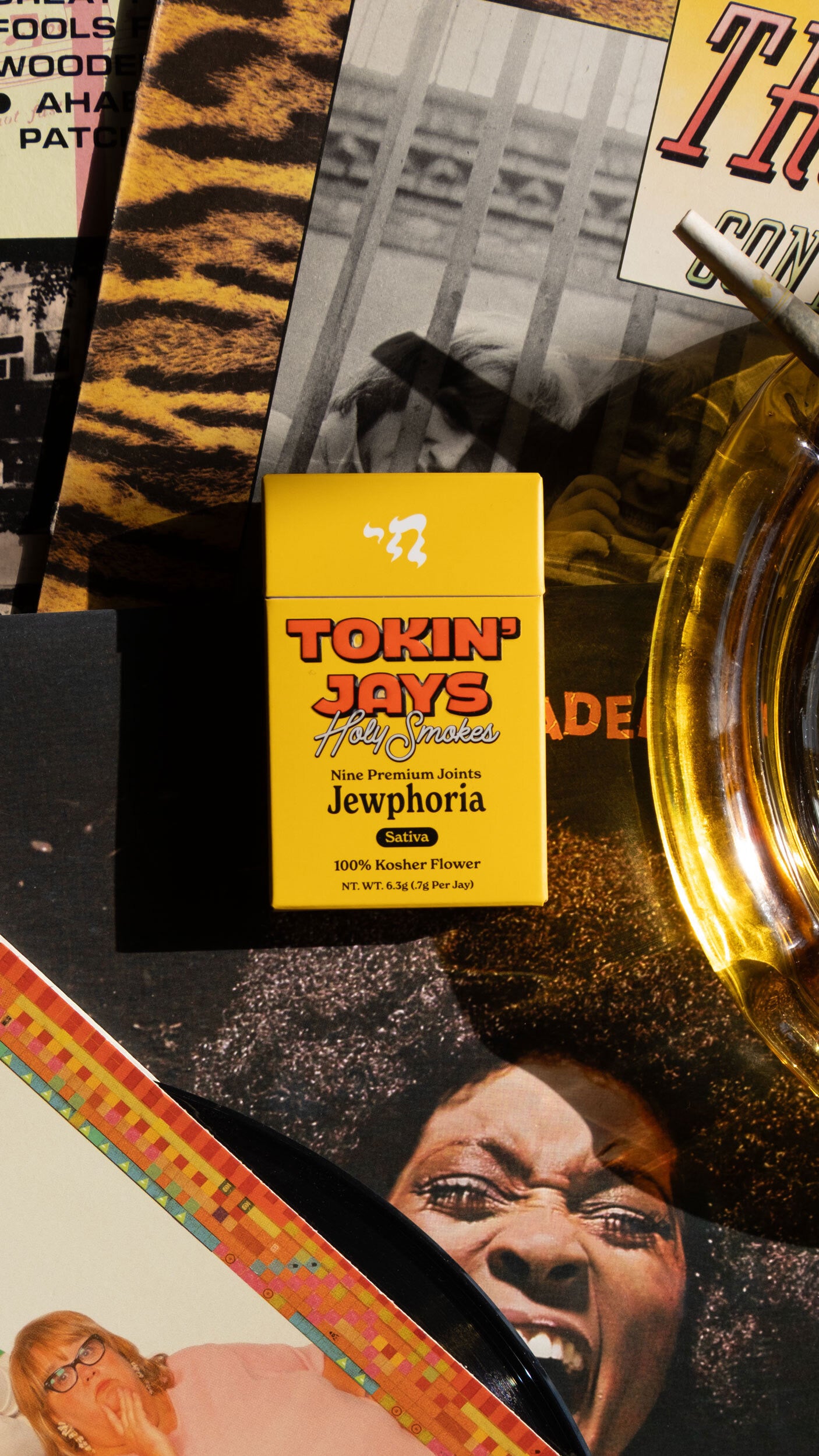 Collage of various images with a prominent yellow 'Tokin' Jays' pack laying on top.