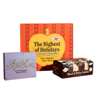 Three packaged products arranged on a solid orange studio background: a purple box of Highs Honey THC-infused honey sticks, a large red and yellow gift box reading 'The Highest of Holidays' with a yellow apple graphic, and a black box of Black & White Cookies.