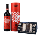 A gift set from Tokin' Jew featuring a bottle of juice, a red cylindrical tube, and a box of Black & White Cookies, arranged on a light blue background.